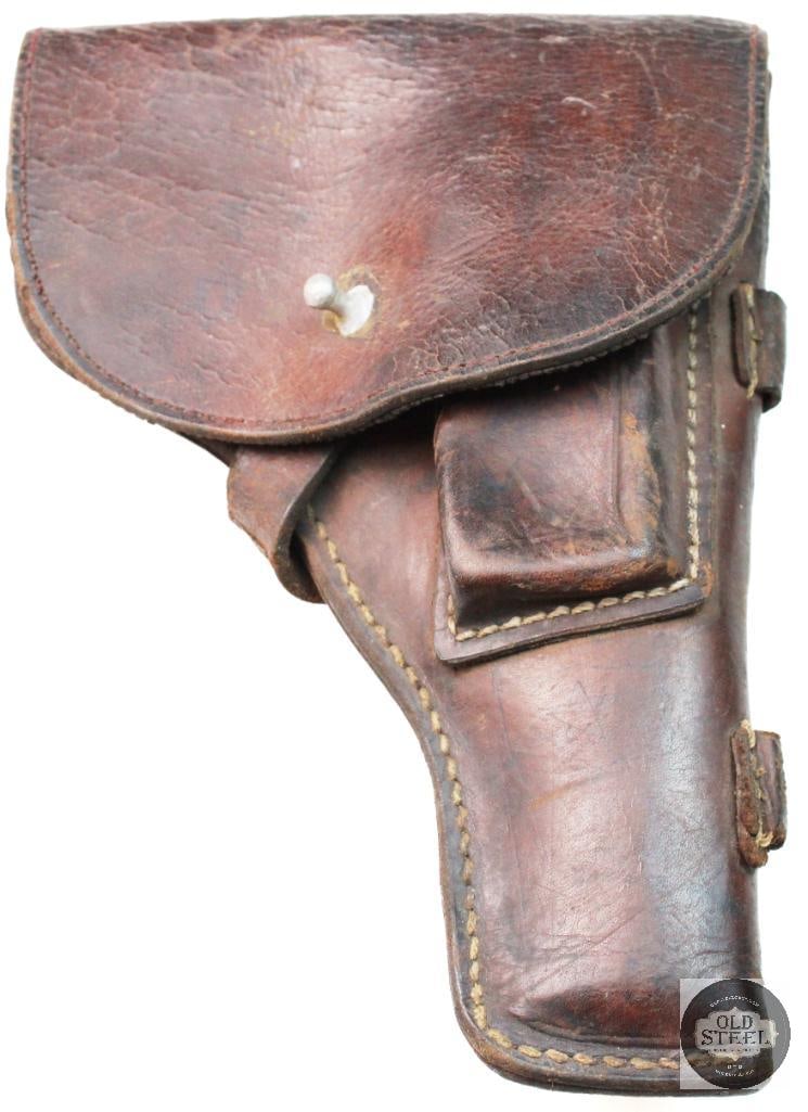 North Vietnam Army tt33 leather holster: North Vietnam Army tt33 leather holster. corduroy lining, brown leather, cleaning rod loops, white stitching. Shows signs of issue and field use expected for its age. The leather has stiffened with