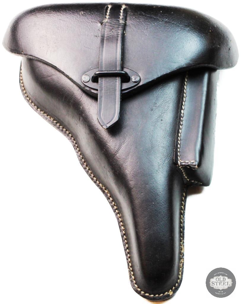 New made walther P38 holster: New made walther P38 holster in black leather. White stitching, metal hardware, with spare magazine pouch, and retrieval pull tab. Some finish inconsistencies on the back of the holster. 