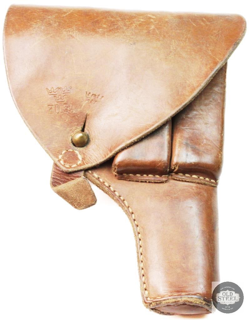 Swedish m/1907 Browning FN M1903 pistol holster:  This is a vintage Swedish leather holster designed for the Husqvarna M1907 pistol. It features a brown leather exterior with an integrated pouch for spare magazines. These holsters were utilized