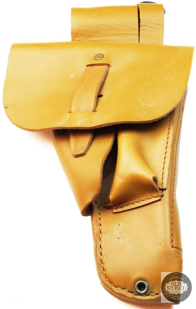 French Foreign Legion 9mm Pistol Holster: This is an original French Foreign Legion 9mm pistol holster featuring a desert tan leather finish. The design is modeled after the German WWII P-38 holster and was adopted by the French military
