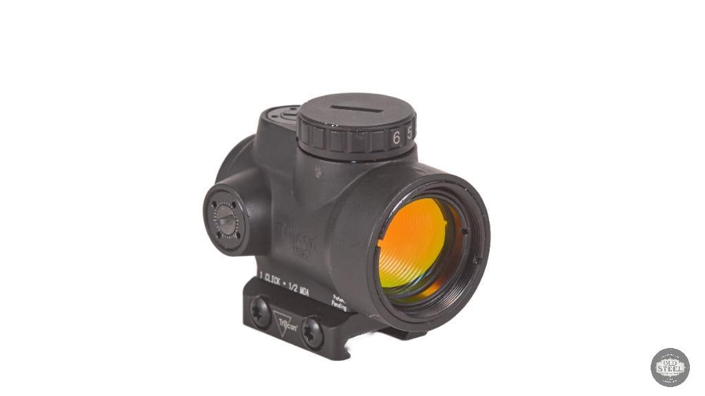 Trijicon MRO Red Dot Sight w/ Low Picatinny Mount: Trijicon MRO red dot sight mounted on a low Picatinny mount. The optic functions great with clear glass and reliable operation. The sight shows minimal signs of use and wear, with only light handling 
