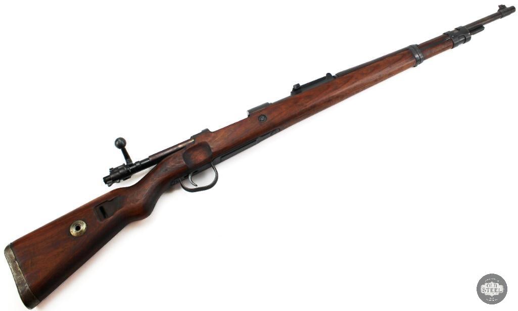 Mauser K98K 8mm Mauser C&R Rifle Yugoslav Reworked Winter Trigger Guard: This Mauser Mod 98 is chambered in 8mm Mauser and began life as a German World War II-era Mauser before being reworked and remarked by Yugoslavia following the war. Many captured German rifles were re