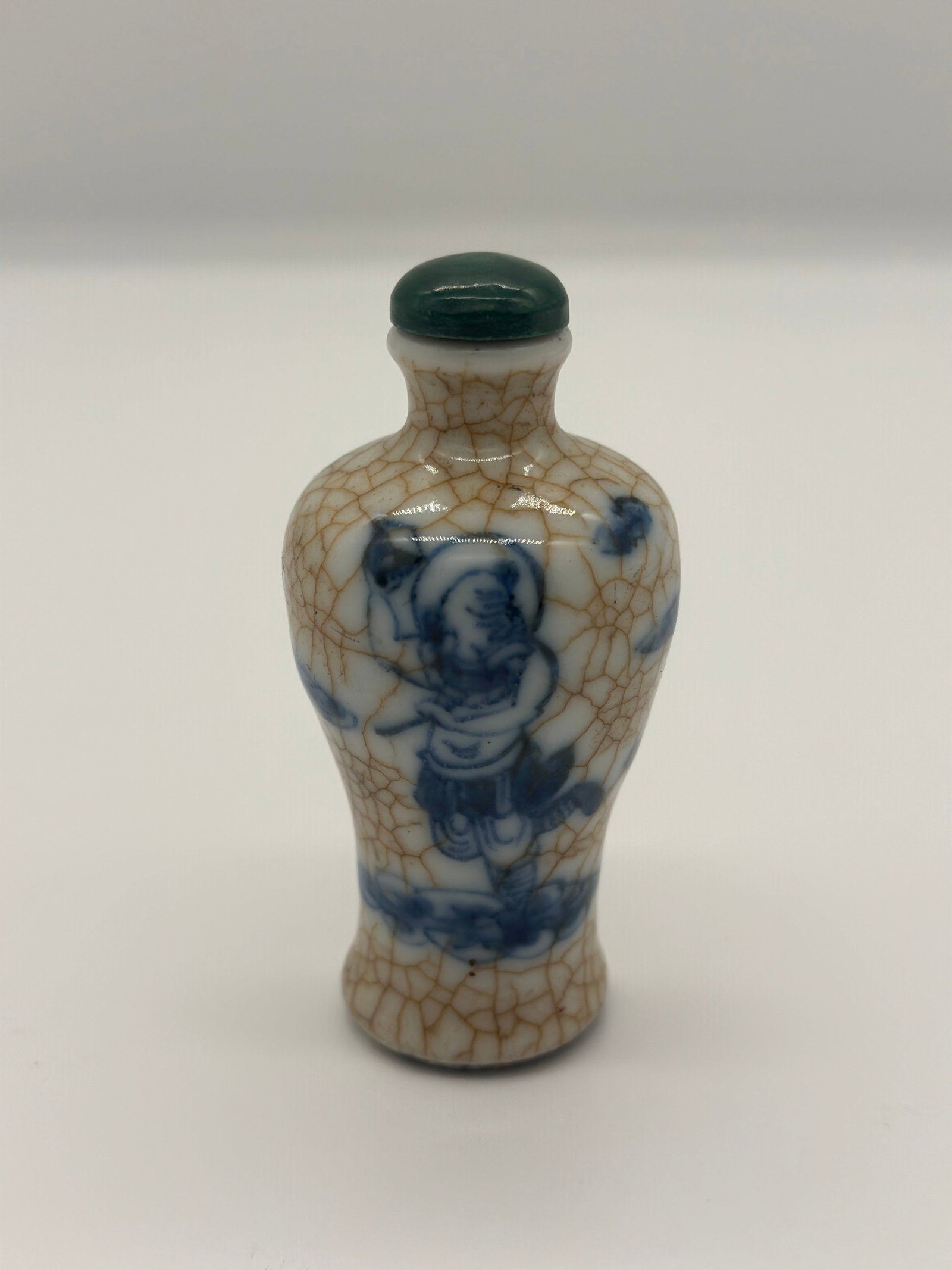 A Qing Dynasty blue and white Ge-glazed 'figures' snuff bottle (1 of 6)