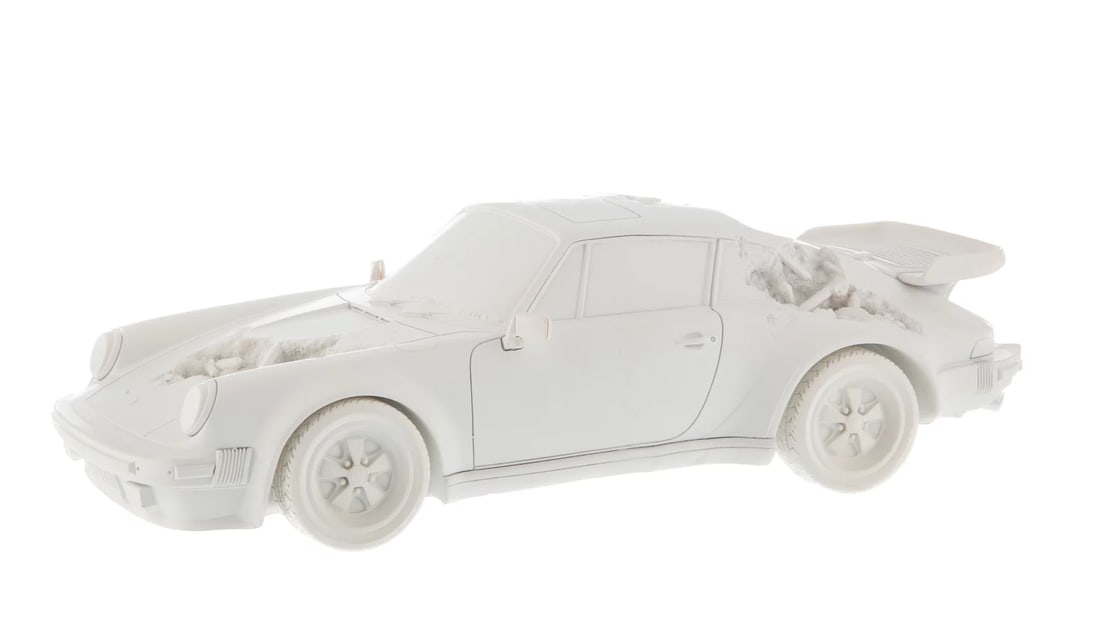 Daniel Arsham: Eroded Porsche 911 Turbo (930) White , 2020: Daniel Arsham: Eroded Porsche 911 Turbo 930 (Sculpture Edition) (White), 2020. 3 1/2 × 12 1/2 in | 8.9 × 31.8 cm. Hydrostone and quartz crystals. Provenance: Heritage Auctions, Jessica Leigh Collect
