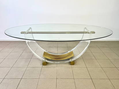 ATTR ROMEO REGA LUCITE AND BRASS DINING TABLE: Dimensions: H 27.5" x W 80”x D 44”. Arch dining table with oval glass top with acrylic glass frame, mounted on a brass base. Attributed to Romeo Rega 0109