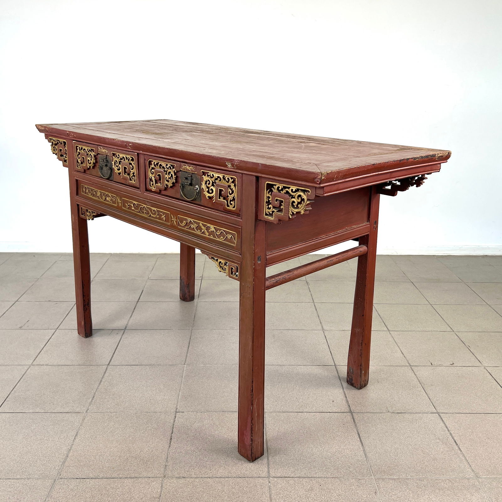 ANTIQUE CHINESE CARVED WOOD CONSOLE TABLE: Dimensions: H 35.3" x W 58.3" x D 25". Chinese carved wood altar table, painted in red and gold with two drawers with brass handles. 0121