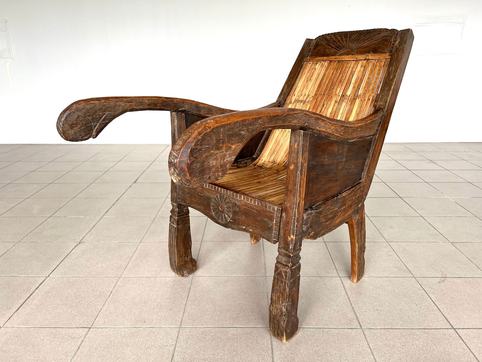 ANTIQUE 18C ARMCHAIR: Dimensions: H 38" x W 23.5" x D 49" x SH 18". Antique South Asian hand carved armchair.