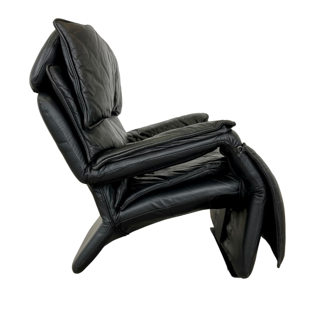 PERCIVAL LAFER BRAZILIAN LEATHER "PONY" CHAIR: Dimensions: H 35” x W 29” x D 30 x SH 18”. Brazilian black leather adjustable lounge chair by Percival Lafer. The additional footrest extends automatically when reclined. The headres