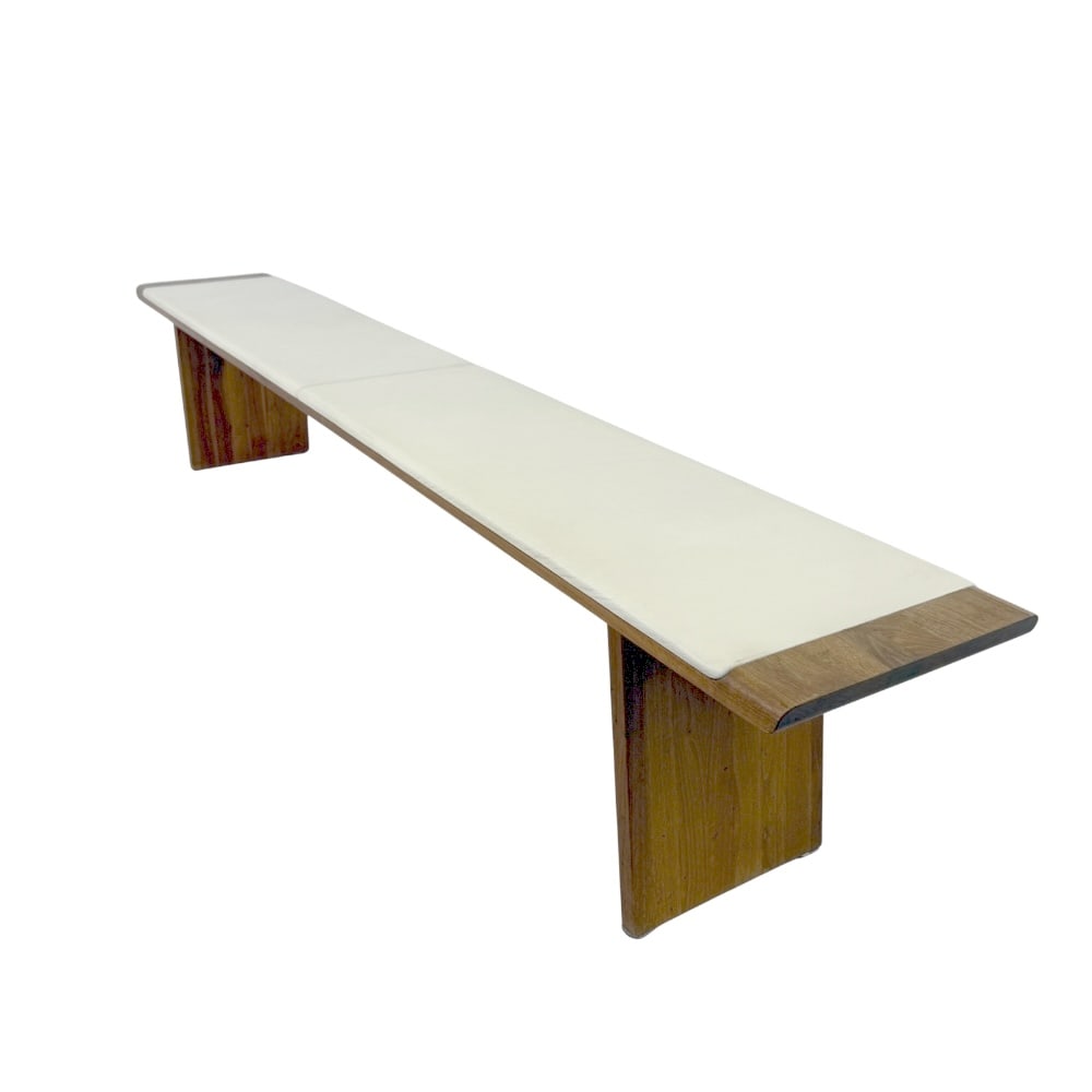 DANISH TEAK AND LEATHER BENCH: Dimensions: H 18.5” x W 98.3” x D 15”. Vintage Danish white leather and teak wood bench.