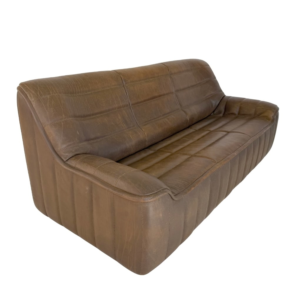 DE SEDE DS-84 BUFFALO LEATHER SOFA: Dimensions: H 32.7” x W 74.5” x D 33.5” x SH 16”. De Sede DS-84 Buffalo leather three-seat sofa.