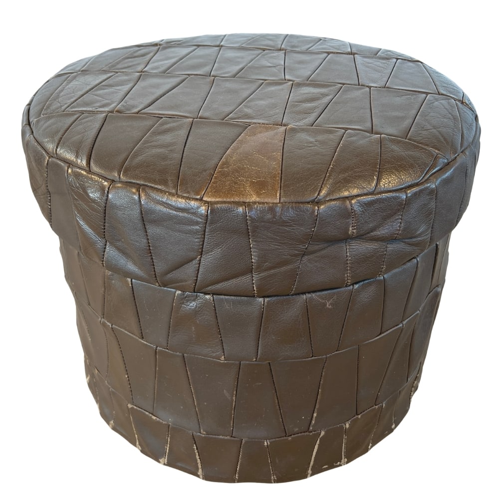 DE SEDE LEATHER STORAGE POUF: Dimensions: H 13” x W 16”. De Sede brown patchwork leather storage pouf.
