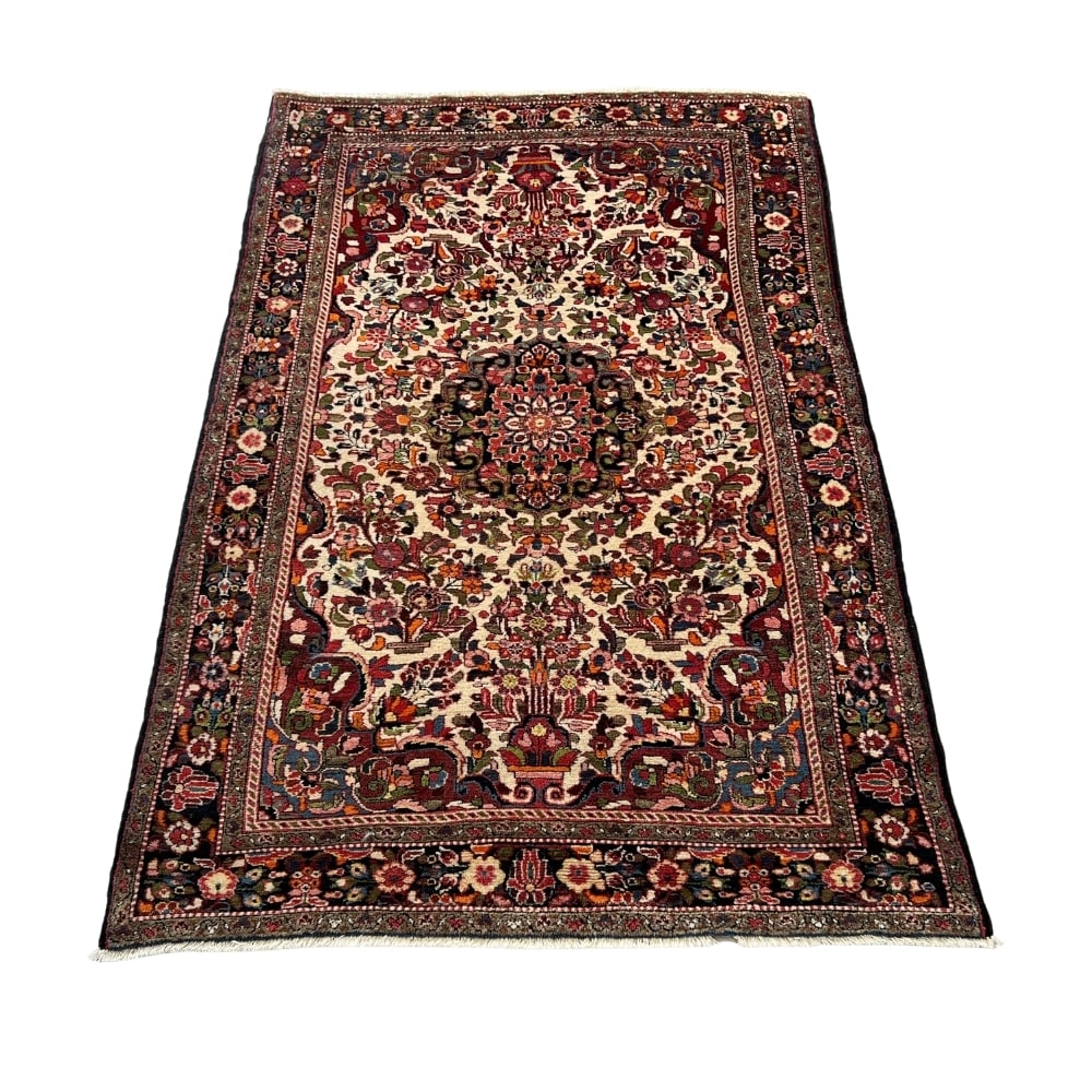 HAND-KNOTTED PERSIAN BAHTIARI WOOL RUG: Dimensions: H 7’10 x W 4’8 ½. Vintage Bahtiari Persian wool rug.