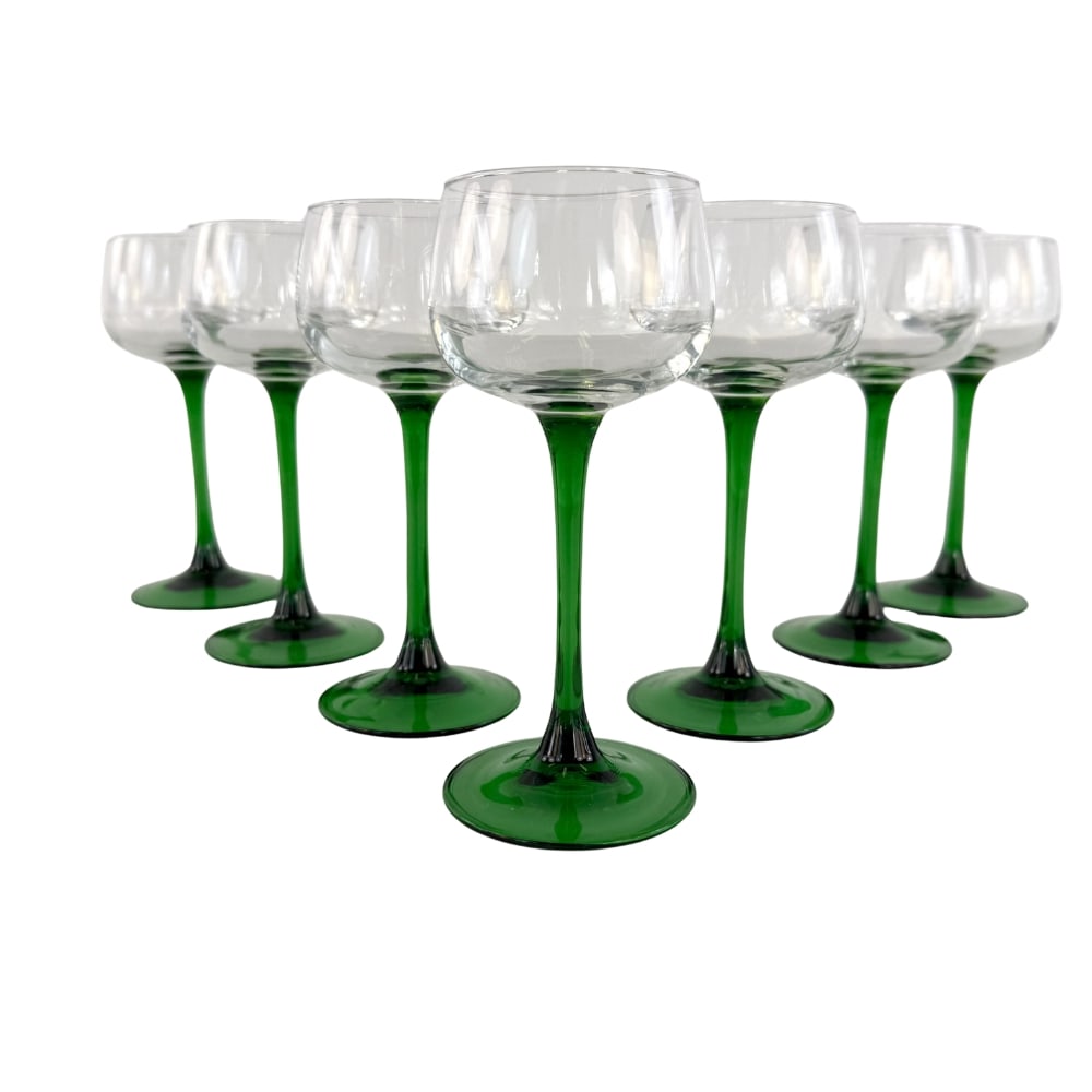 (7) LUMINARC GREEN STEM WINE GLASSES: Dimensions: 6.5” x W 2.5”. Set of 7 Luminarc France green stem wine glasses.
