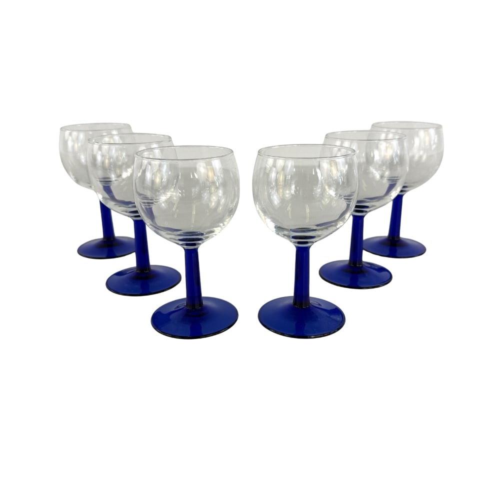 (6) FRENCH BLUE STEMMED WINE GLASSES: Dimensions: H 5” x W 2.5”. Set of 6 French cobalt blue stemmed wine glasses.