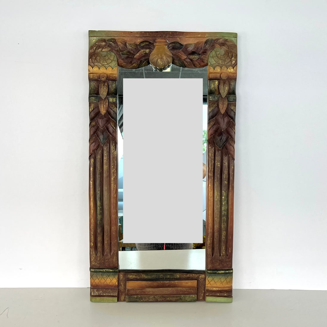 CARVED WOOD WALL MIRROR: Dimensions: H 27.3” x W 15”. Hand painted carved wood wall mirror.