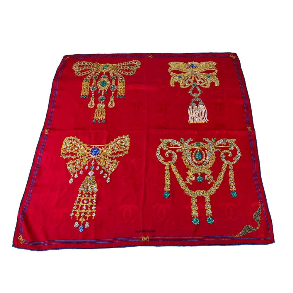 MUST DE CARTIER SILK SCARF: Dimensions: H 32.7” x W 32.7”. Vintage Must De Cartier Paris red silk scarf with hand-rolled edges.