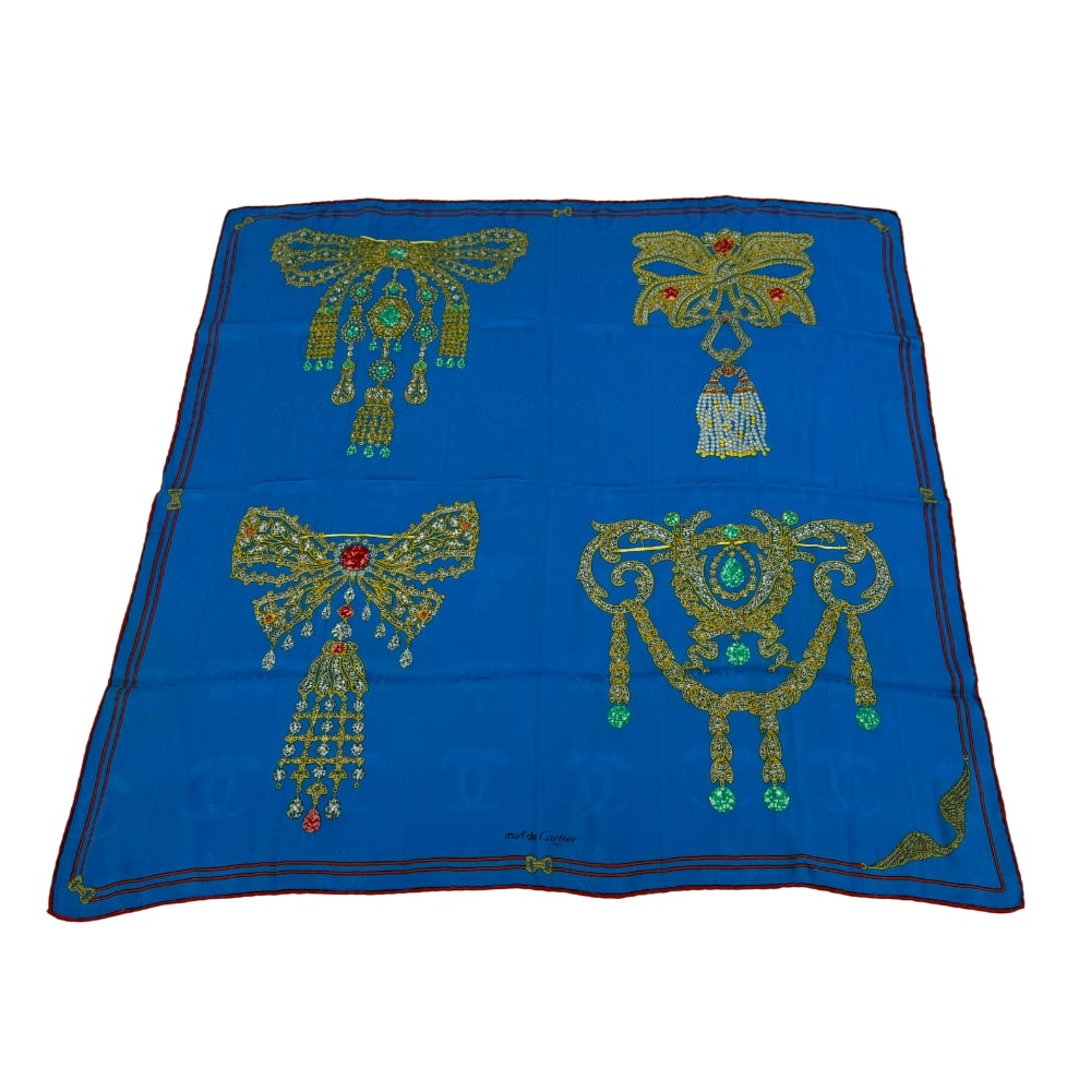 MUSTE DE CARTIER SILK SCARF: Dimensions: H 33” x W 33”. Vintage Muste De Cartier “Collections of Brooches” silk scarf.