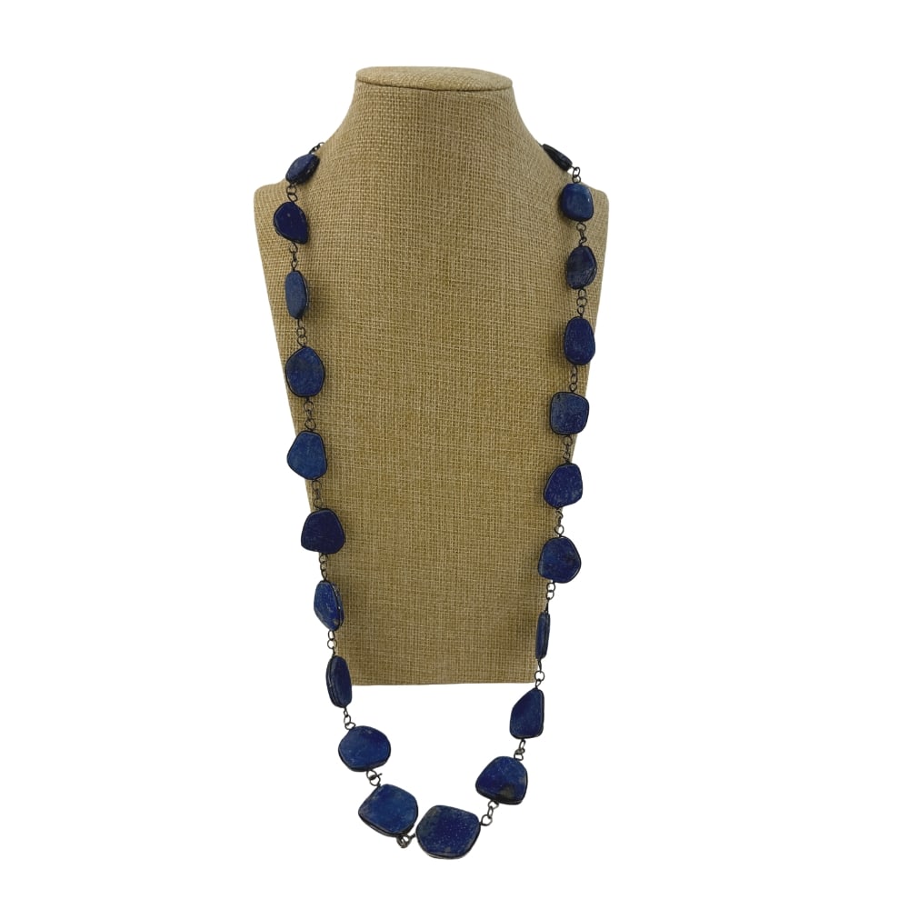 LAPIS LAZULI NECKLACE: Dimensions: W 15”. Necklace with irregularly shaped lapis lazuli stones.