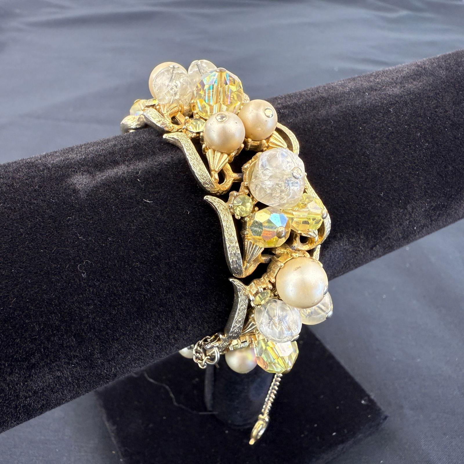 KENNETH J. LANE BRACELET: Dimensions: W 7.3”. Vintage Kenneth J. Lane bracelet with faux pearls and aurora borealis crystals.