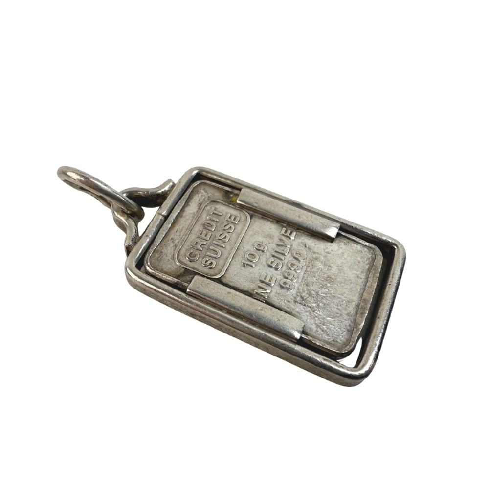 CREDIT SUISSE 10G BULLION BAR PENDANT: Dimensions: H 1.5”/ 17g. Vintage Credit Suisse 10g fine silver bullion bar pendant.