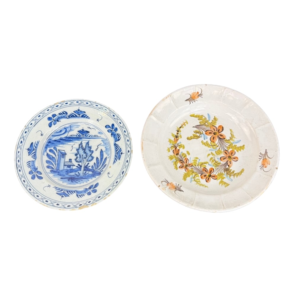 (2) HAND PAINTED CERAMIC PLATES: Dimensions: W 10.5”/ 12.5”. Antique blue and white Delft ceramic plate and ceramic plate with floral motifs, both hand painted.