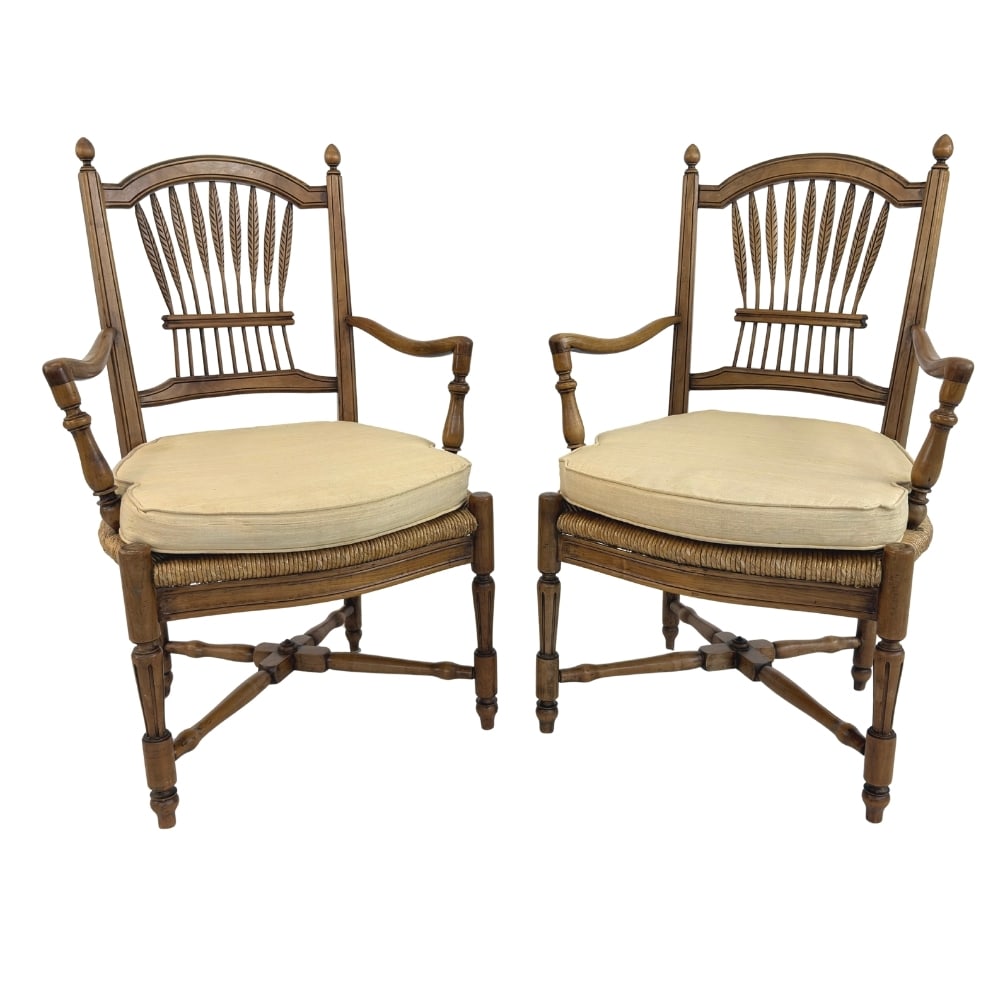 FRENCH COUNTRY STYLE WHEAT-BACK ARMCHAIRS, A PAIR: Dimensions: H 38” x W 22” x SD 19.5” x SH 16”. Pair of French Country style wheat sheaf back armchairs with rush seats and turned legs with stretchers.