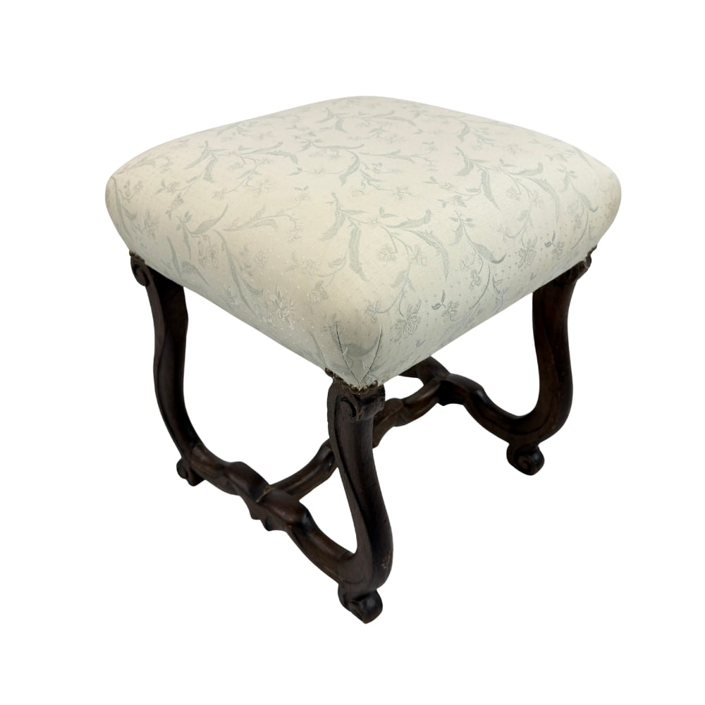 ANTIQUE VICTORIAN STOOL: Dimensions: H 21” x W 16.3”. Antique Victorian stool in original light beige floral fabric and carved legs.