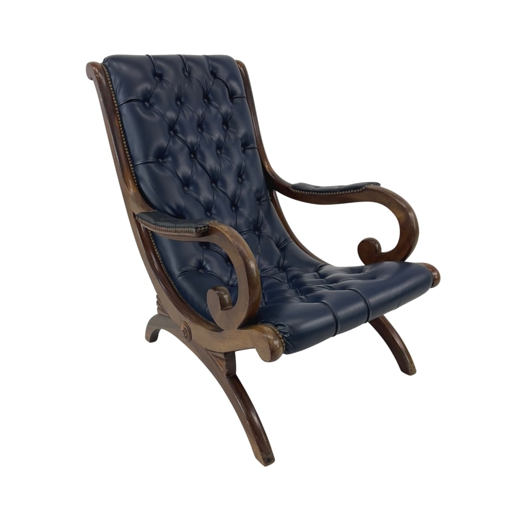 REGENCY STYLE LEATHER ARMCHAIR: Dimensions: H 36” x W 25.5” x D 37.5” x SH 15.5”. Antique Regency style slipper chair in original blue leather with nail head trim detail.