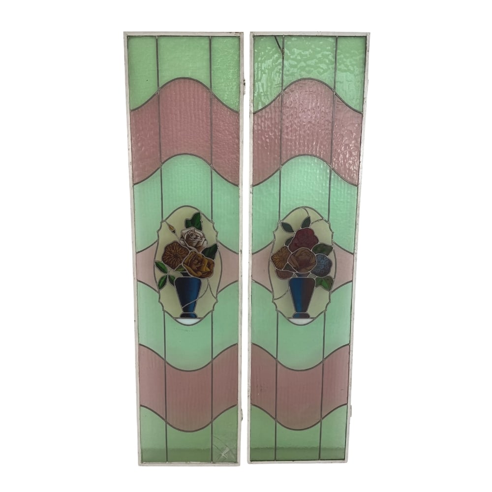 ANTIQUE STAINED GLASS PANELS, A PAIR: Dimensions: H 64” x W 16” (1pc). Pair of Antique stained glass window panels with rose motifs.