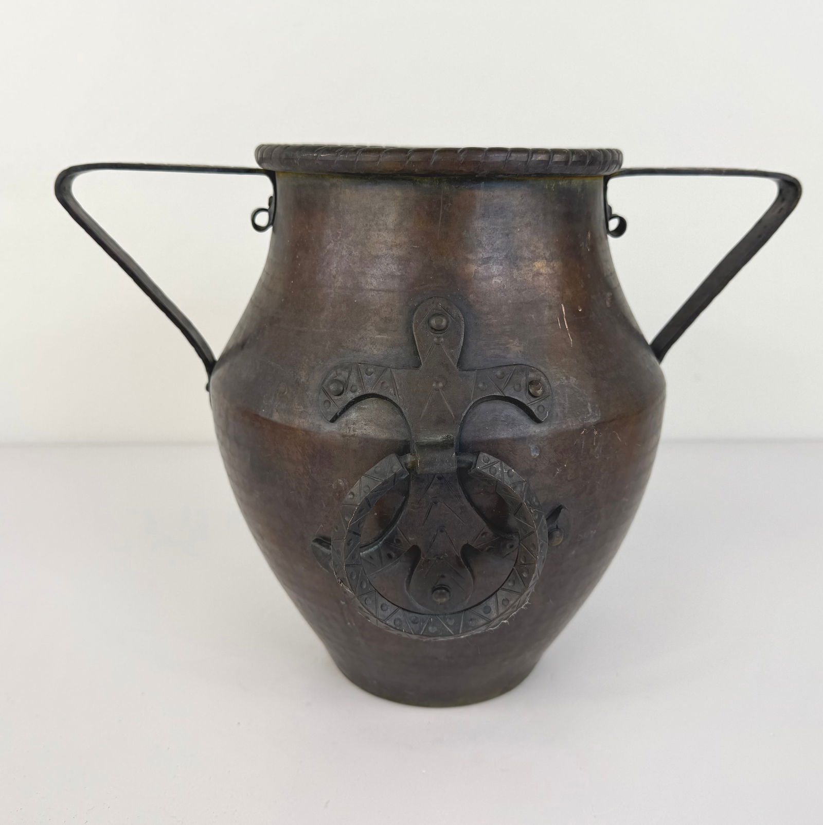 ANTIQUE COPPER AMPHORA: Dimensions: H 10.7” x W 6.5”. Antique hand hammered copper amphora with two handles.