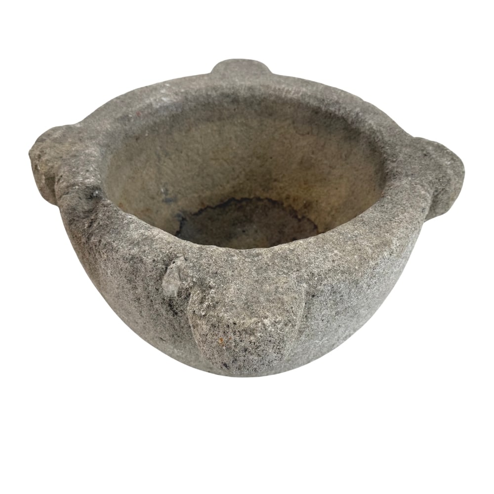 ANTIQUE STONE MORTAR: Dimensions: H 10” x W 17.5”. Antique stone mortar with four handles around the rim.