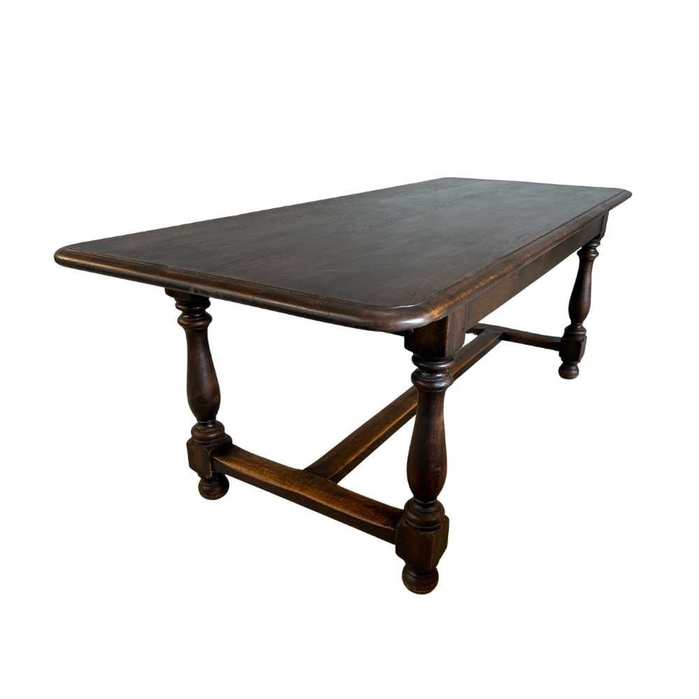 VINTAGE FARMHOUSE DINING TABLE: Dimensions: H 29.7” x W 79.5” x D 33.5”. Vintage French Farmhouse solid oak dining table with four turned baluster legs with H-shaped stretcher.