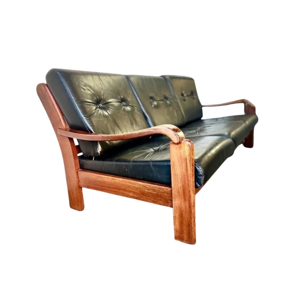 DANISH THREE-SEATER SOFA MANNER OF HOLSTEBRO: Dimensions: H 30.3” x W 79.9” x D 35”. Vintage Danish three-seater sofa manner of Holstebro with teak frame and original black faux leather loose padded cushions.