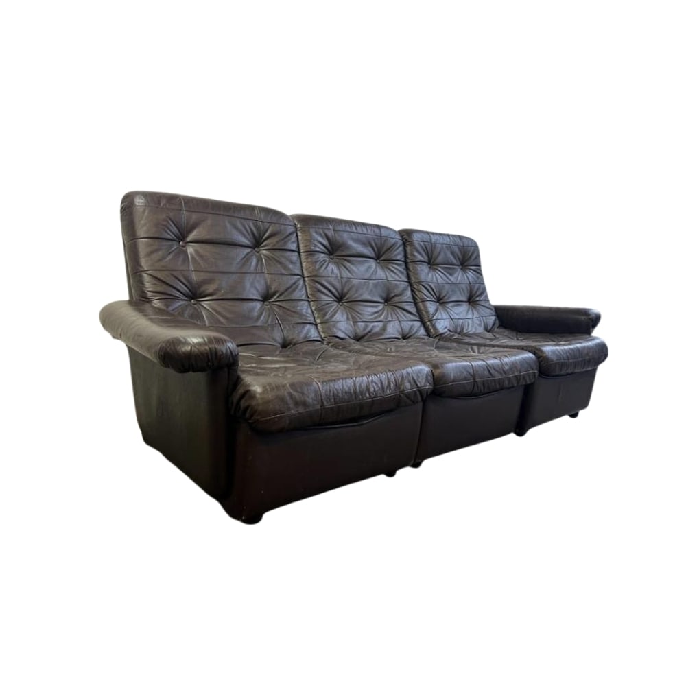 VINTAGE LEATHER PATCHWORK MODULAR SOFA: Dimensions: H 32.2” x W 85” x D 32.6”. Vintage brown leather three-seater patchwork modular sofa.