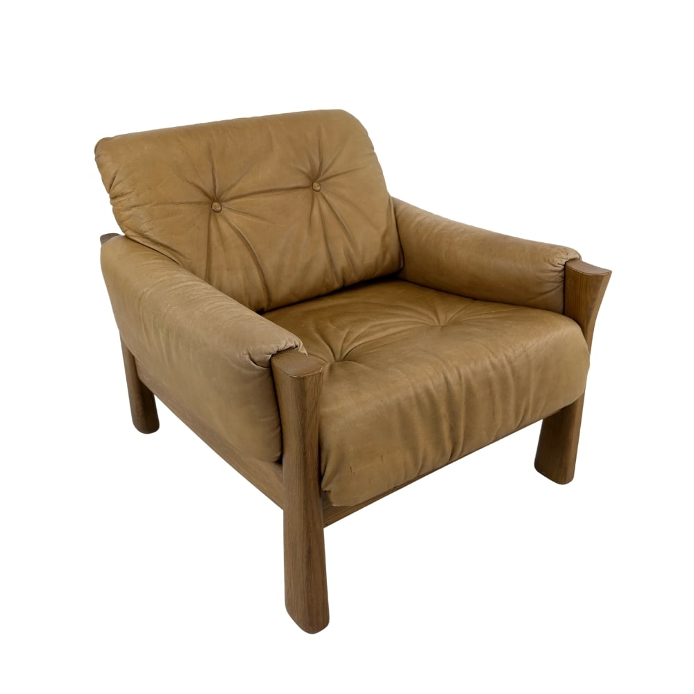 ARMCHAIR ATTR. TO PIERRE CHAPO: Dimensions: H 28” x W 30.5” x D 34.5” x SH 16.5”. Vintage light brown leather Brutalist armchair attr. to Pierre Chapo.