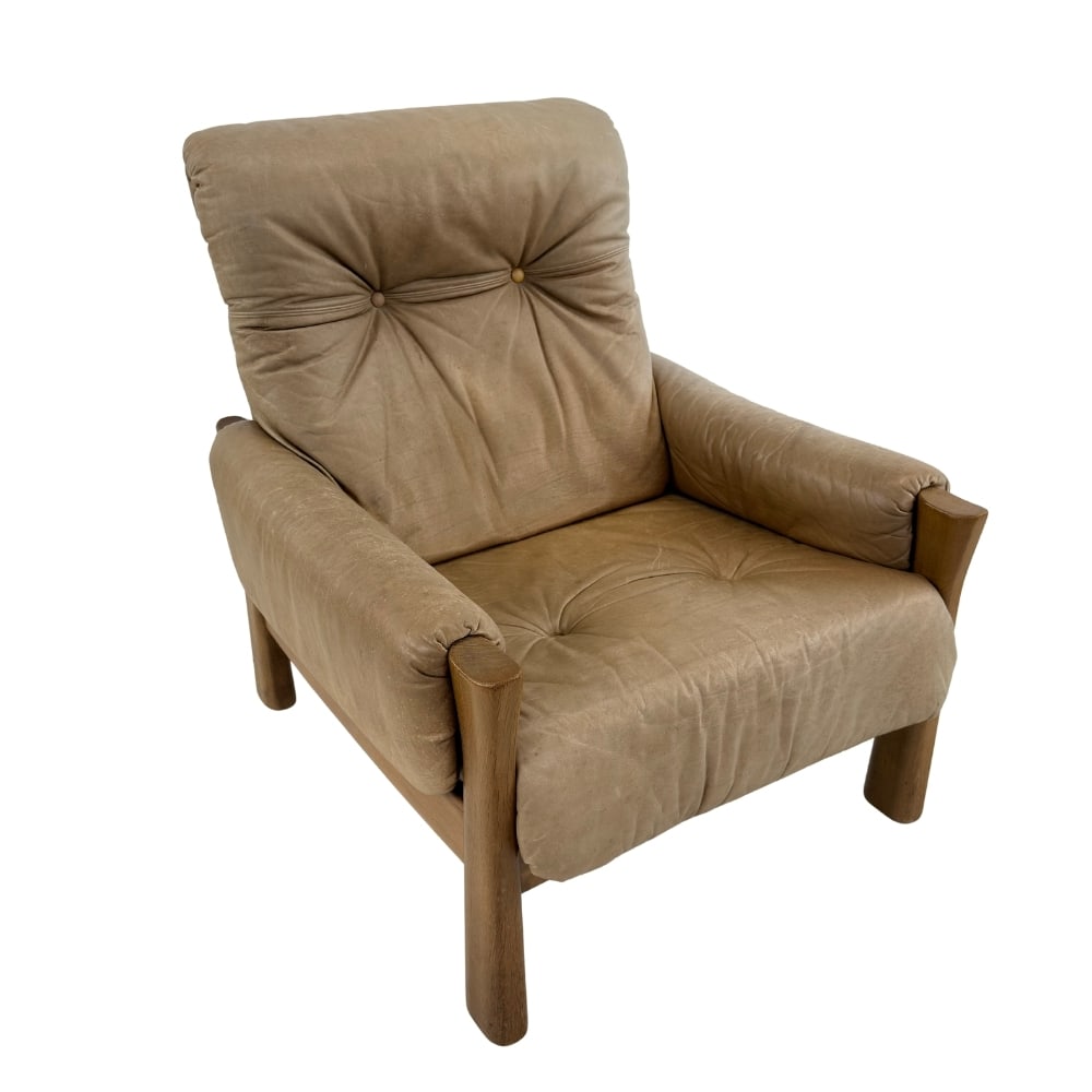 ARMCHAIR ATTR. TO PIERRE CHAPO: Dimensions: H 35.5” x W 31.5” x D 36” x SH 16.5”. Vintage brown leather Brutalist armchair attr. to Pierre Chapo.