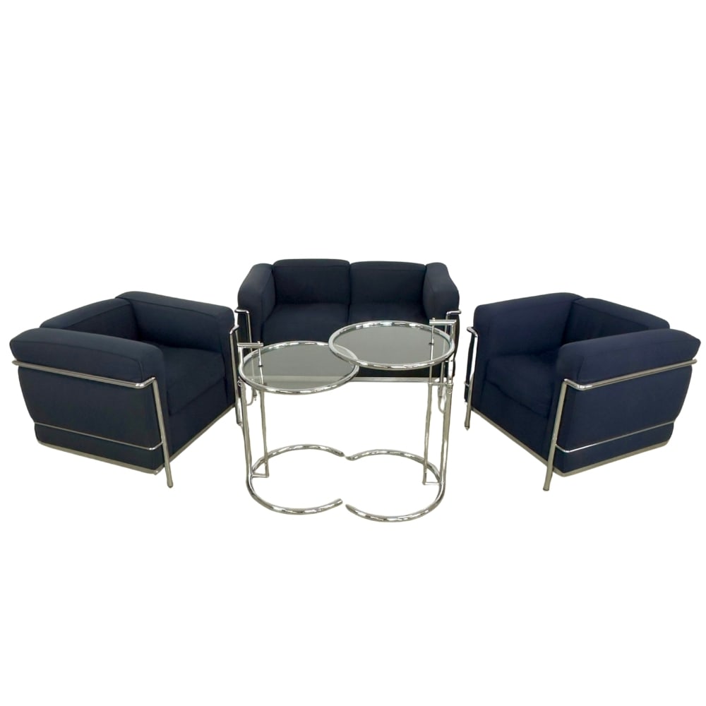 CASSINA LE CORBUSIER ARMCHAIRS, A PAIR: Dimensions: H 26.5” x W 30.3” x D 26.5” x SH 18”. Pair of Cassina Le Corbusier LC 2 pair of armchairs in dark blue fabric and polished chrome frame. Stamped.