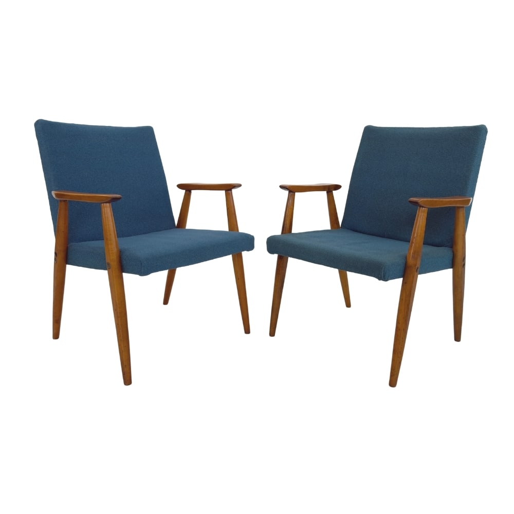 HANS J. WEGNER EASY CHAIRS, A PAIR: Dimensions: H 31.5” x W 19” x D 24.5” x SH 17”. Pair of GE 260 teak easy chairs by Hans J. Wegner with original blue fabric.