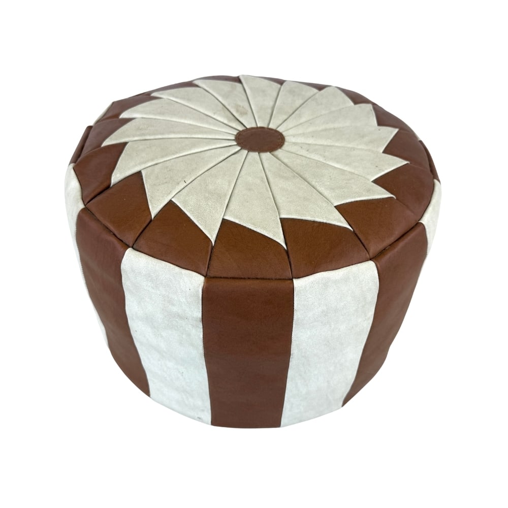 VINTAGE LEATHER POUF: Dimensions: H 11.5” x W 15.5”. Vintage two tone leather pouf.