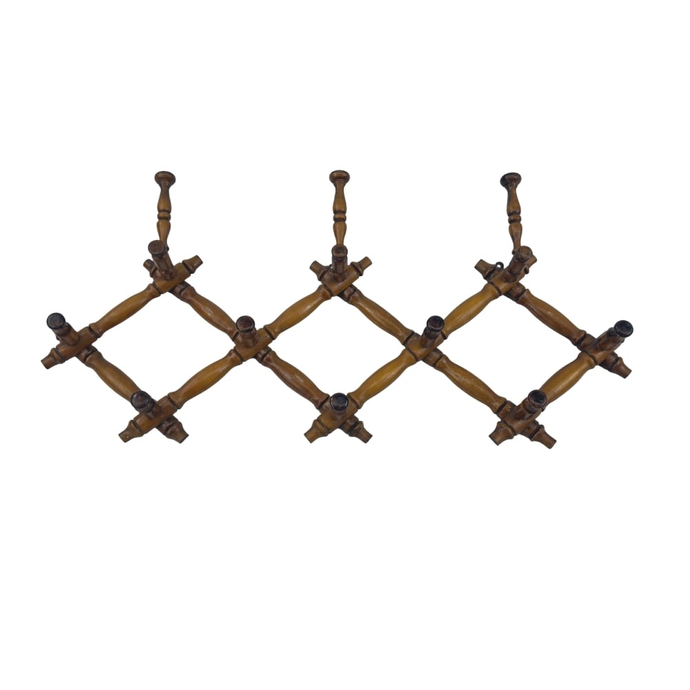 VINTAGE EXTENDABLE COAT RACK: Dimensions: H 21” x W 40.5”. Vintage French extendable wooden coat rack with 13 hooks.