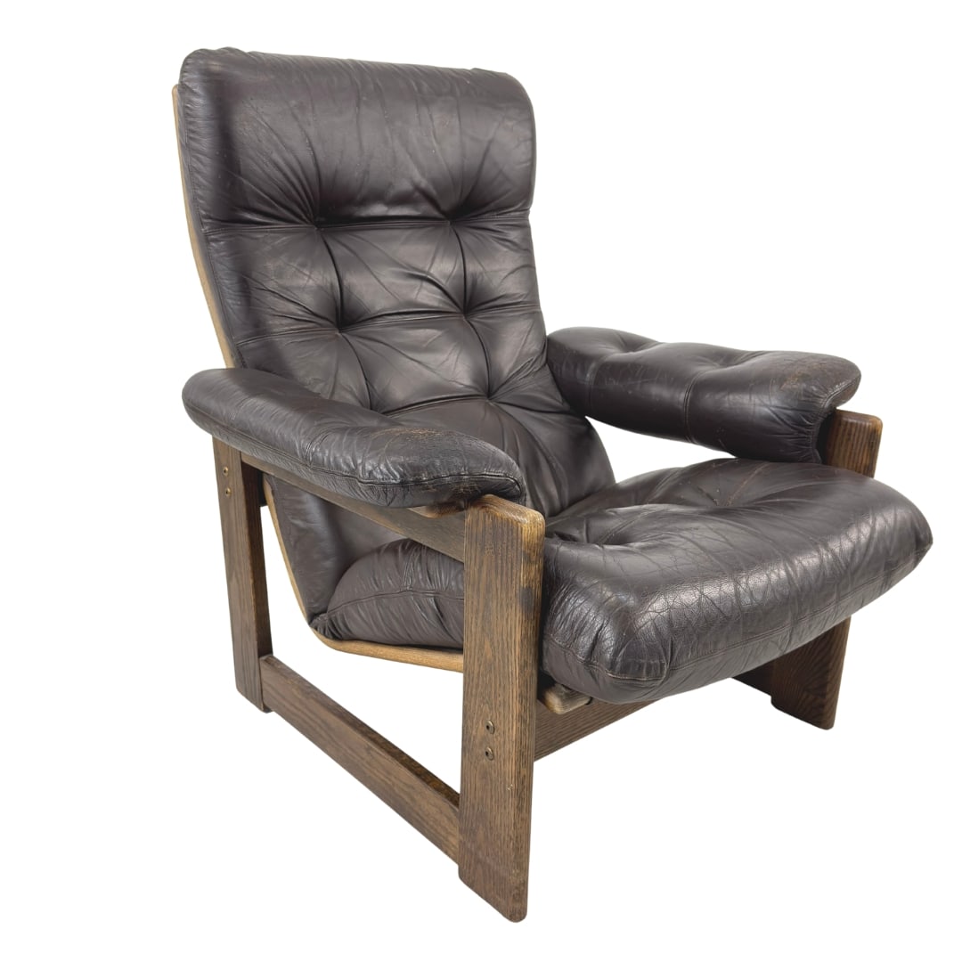 LOUNGE ARMCHAIR BY ARNE NORELL FOR COJA, 1980s: Dimensions: H 37” x W 32” x D 35” x SH 16”. Vintage lounge armchair by Arne Norell for Coja in wenge and dark brown leather.