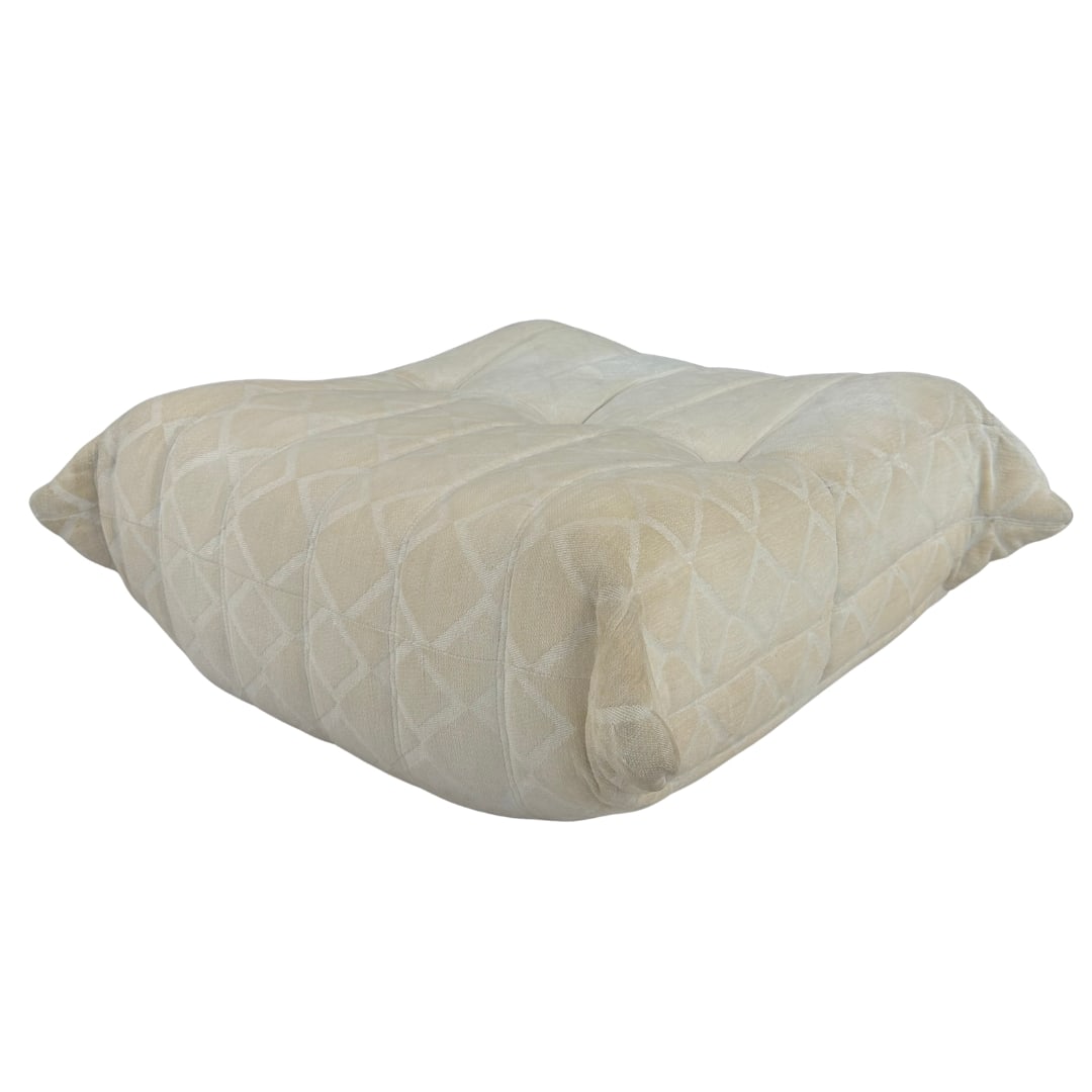 LIGNE ROSET TOGO OTTOMAN: Dimensions: H 14” x W 31”. Togo ottoman by Michel Ducaroy for Ligne Roset, with original beige upholstery. No tags visible, provenance Swiss estate