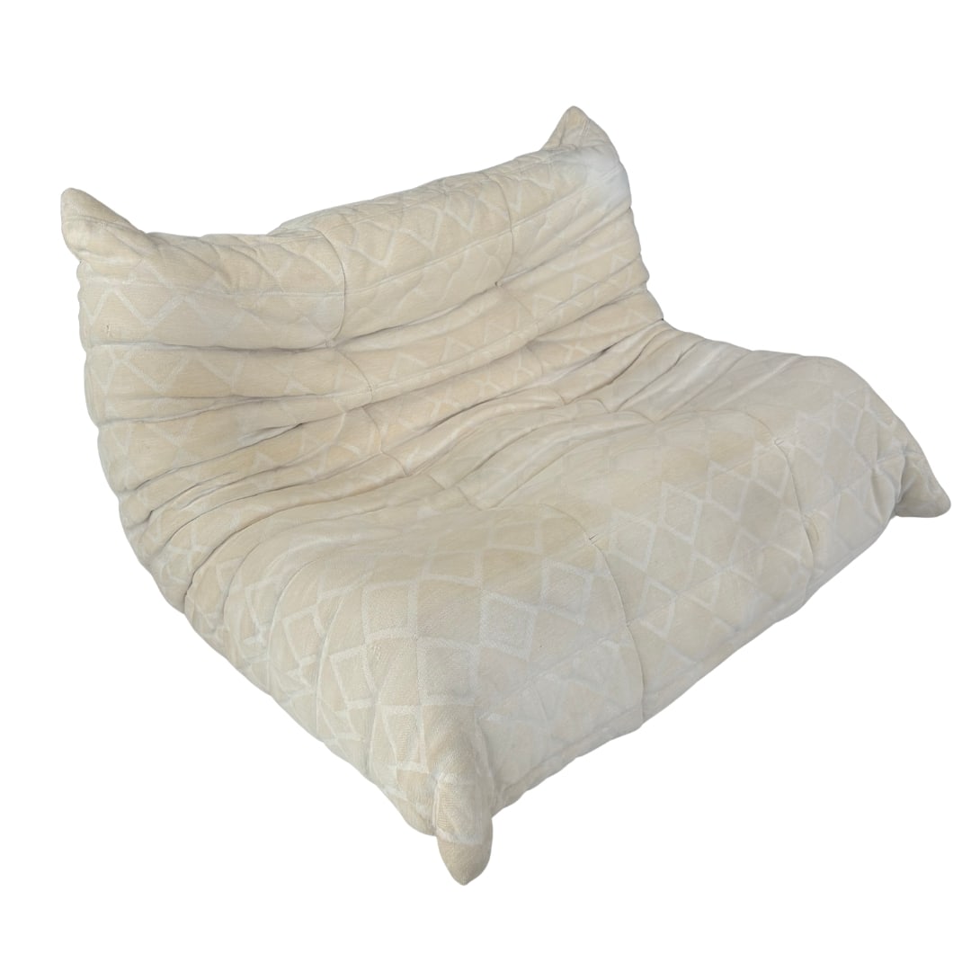 LIGNE ROSET TOGO 2 SEAT SOFA: Dimensions: H 28” W 47” x SD 21” x SH 15.5”. Togo 2-seater sofa by Michel Ducaroy for Ligne Roset, with original beige upholstery. No tags visible, provenance Swiss estate