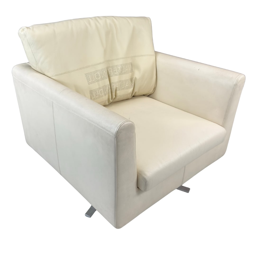 WALTER KNOLL ARMCHAIR: Dimensions: H 26.5” x W 34” x D 34” x SH 16”. Vintage armchair by Walter Knoll in cream leather with aluminum base. Dimensions: H with pillows 33.5".