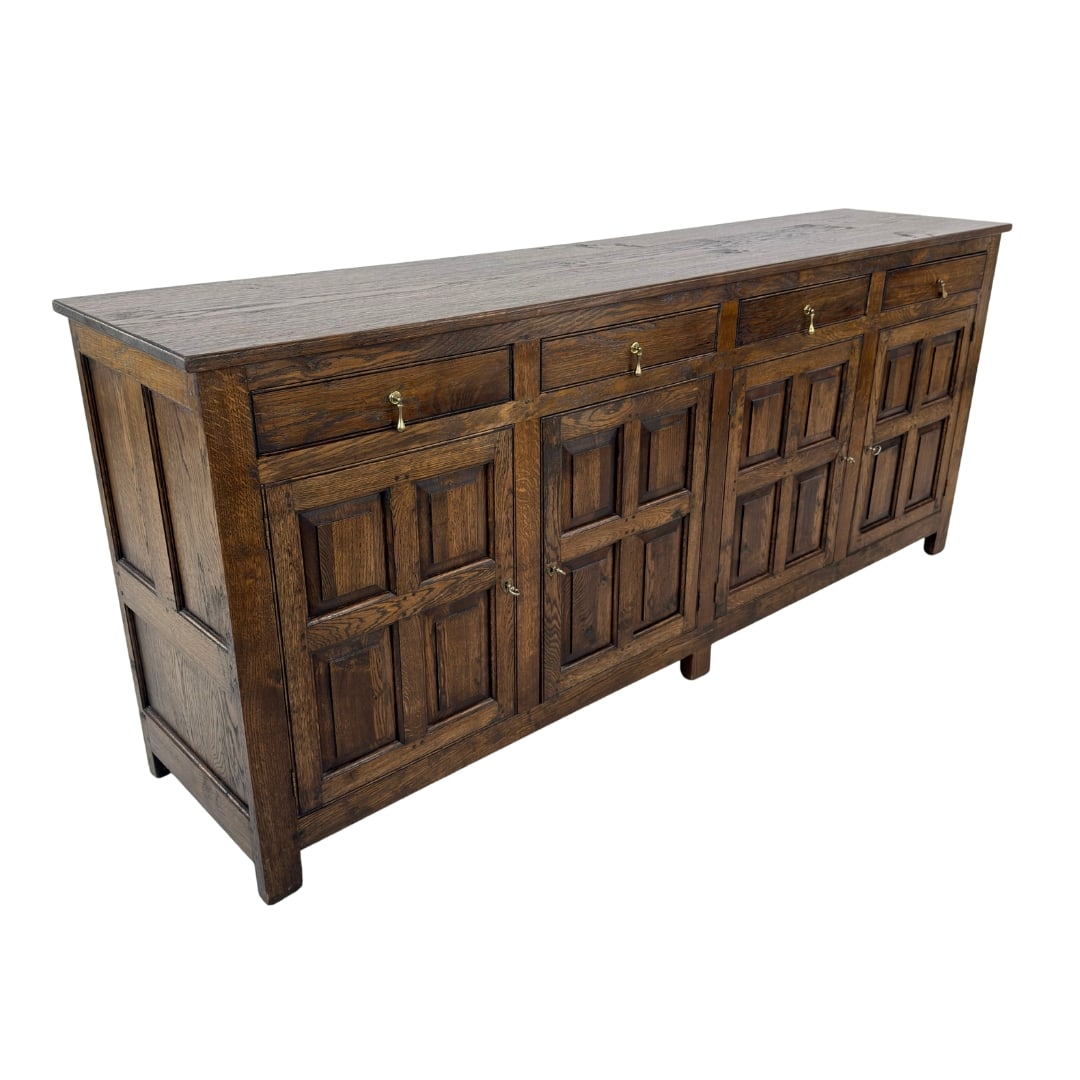 SPANISH REVIVAL SIDEBOARD: Dimensions: H 37.7” x W 90.7” x D 20.3”. Vintage Spanish revival large carved oak sideboard with four small drawers and two big drawers with shelves inside.