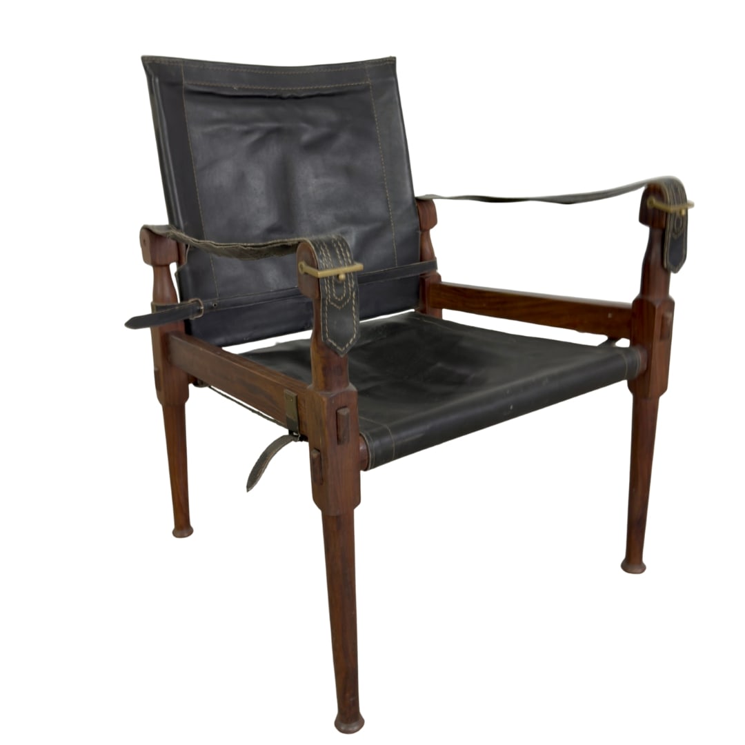 HAYAT BROTHERS ROORKEE CAMPING SAFARI CHAIR, 1960s: Dimensions: H 30” x W 21.5” x D 22” x SH 15”. Vintage Hayat Brothers Roorkee Camping Safari Chair in black leather and wood.
