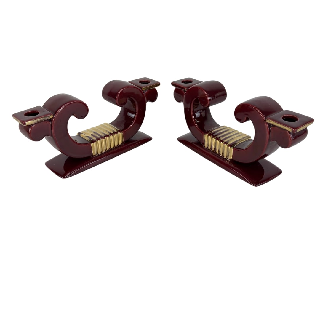 ART DECO CANDLE HOLDERS SAINT CLEMENT, A PAIR: Dimensions: H 5” x W 10.7”. Pair of Art Deco burgundy and gold ceramic candle holders Saint Clement Blanche Letalle.