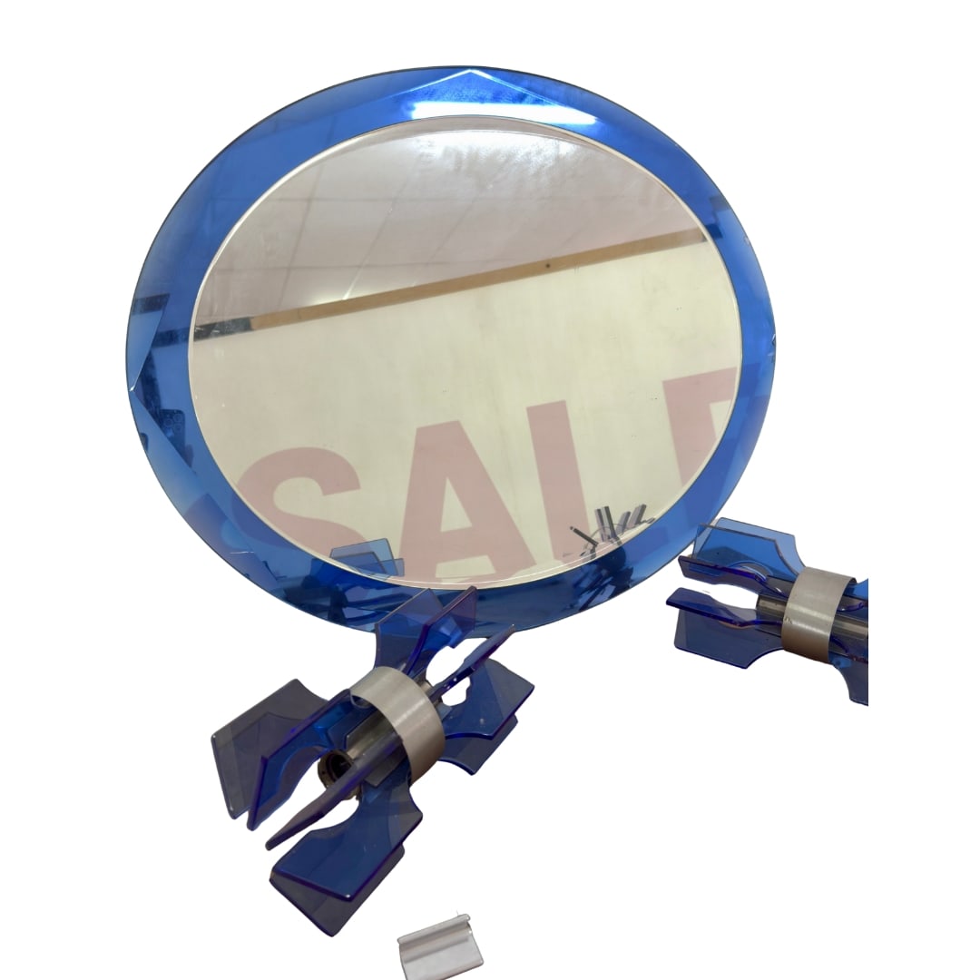 LUPI CRISTAL LUXOR VANITY SET: Dimensions: Diam. 23.6". Vintage Italian Lupi Cristal luxor blue glass bathroom set, consist of round mirror, 2 wall sconces and glass shelf. Dimensions: (shelf) W 21.6". Dimensions approx.