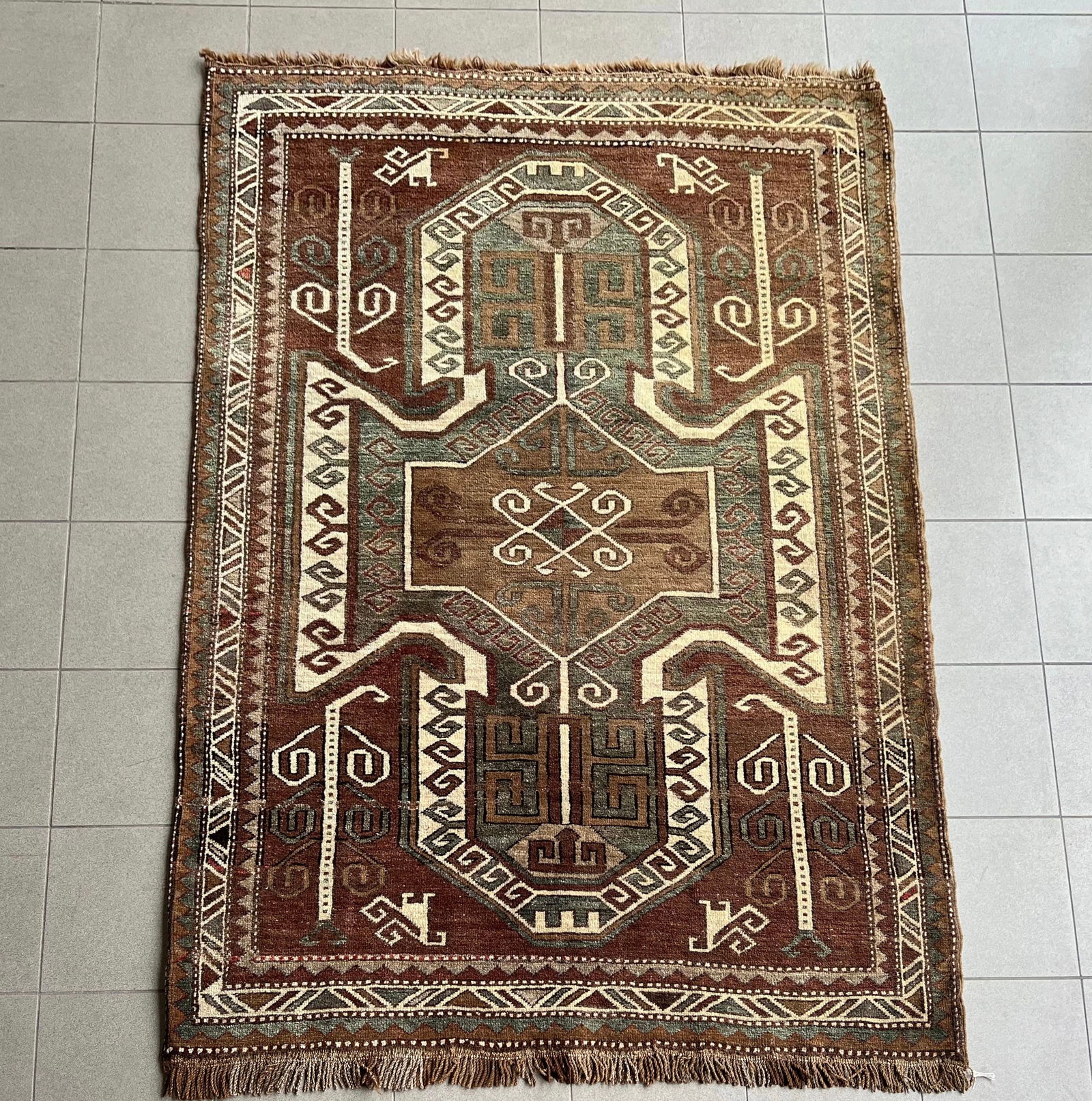 TURKISH KAZAK SHIELD RUG: Dimensions: H 6'11" x W 4'5". Turkish Kazak shield hand knotted rug.