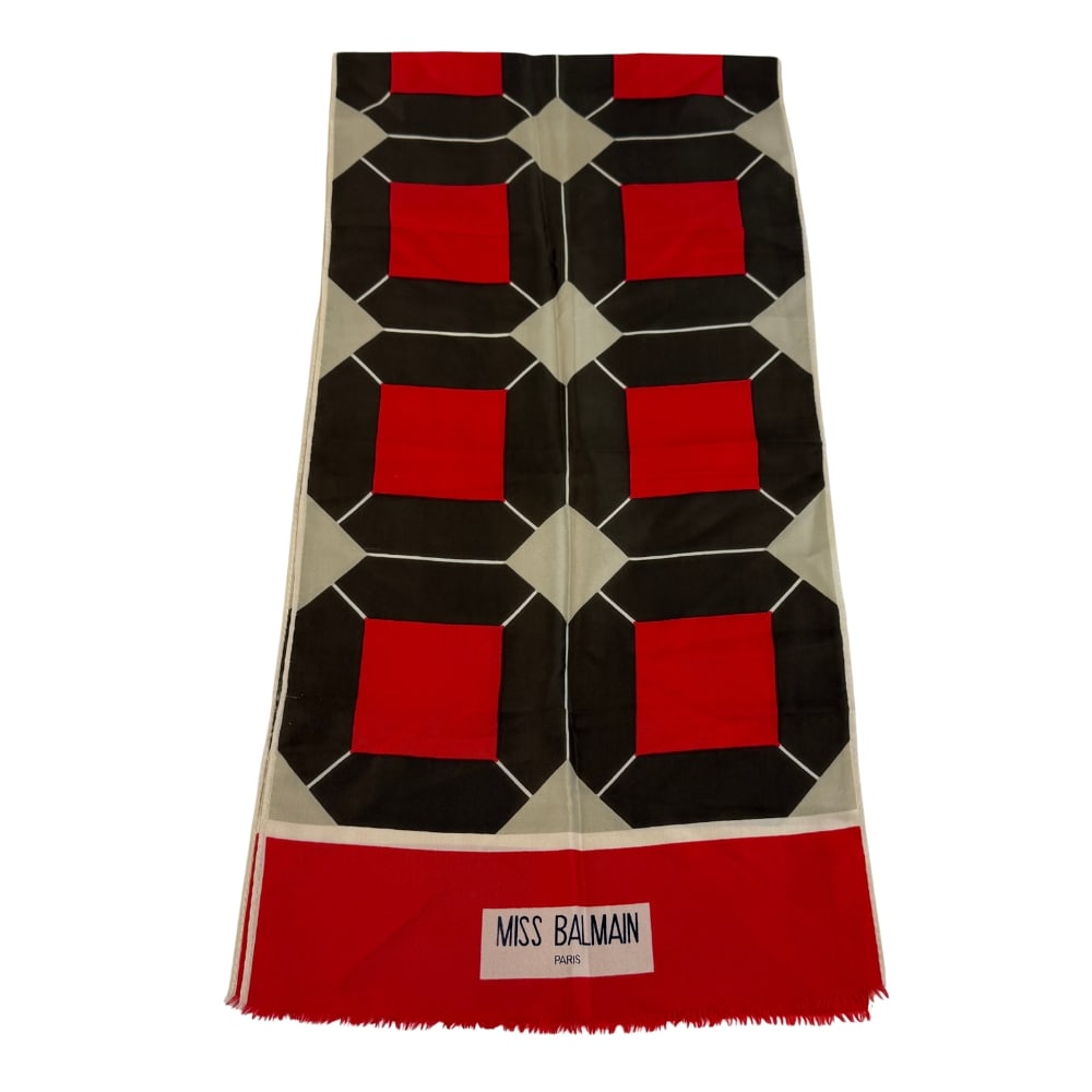 BALMAIN SILK SCARF: Dimensions: 59” x W 15”. Miss Balmain silk scarf with geometric design.